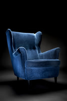 A Blue High-back chair on a dark background